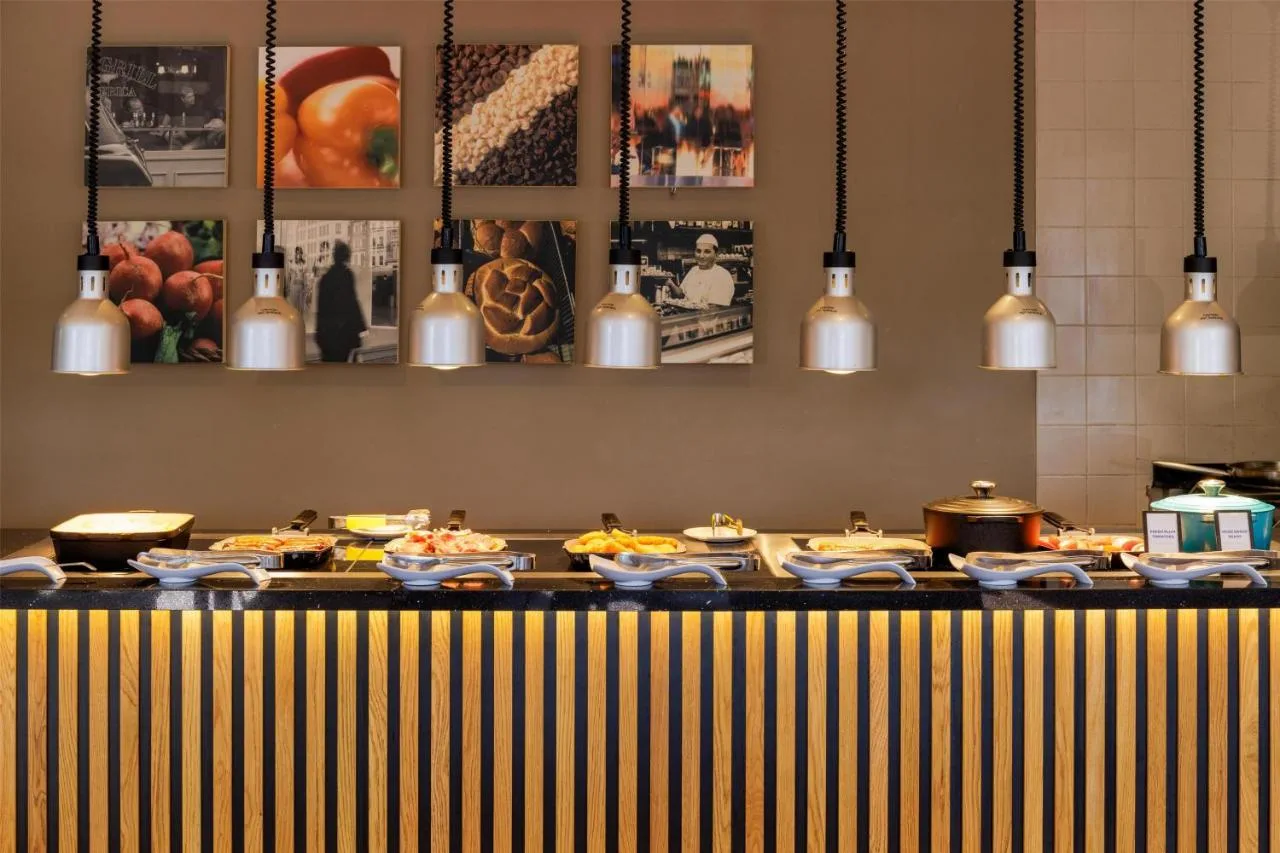 a buffet line with plates of food in a restaurant at Hilton York in York